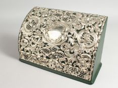 A STERLING SILVER AND GREEN LEATHER STATIONERY CASKET, the hinged cover with profusely pierced and