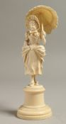 A GOOD EUROPEAN IVORY CARVING OF A YOUNG LADY with a parasol, on a plinth. 6ins high.