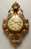 A FRENCH GILTWOOD CARTEL WALL CLOCK, the case with roses. 19ins high.