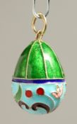A RUSSIAN SILVER AND ENAMEL EGG PENDANT.