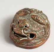 A SMALL EASTERN BRASS FACE. 3.75ins.