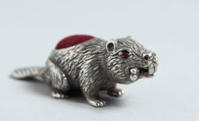 A CAST SILVER BEAVER PIN CUSHION.