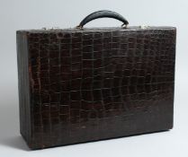 A CROCODILE SUITCASE 16.5ins long x 11.5ins deep x 5ins high