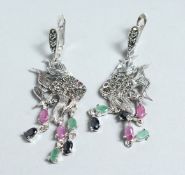 A PAIR OF SILVER MARCASITE, RUBY AND EMERALD ANGEL FISH EAR RINGS.