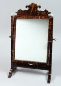 A GOOD TORTOISESHELL MIRROR on a stand 18ins