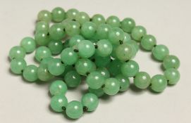 A STRING OF JADE BEADS