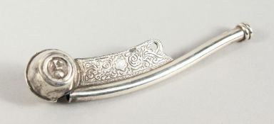 A CAST SILVER BOSUNS WHISTLE.