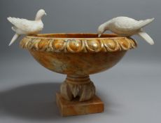 A GOOD VARIAGTED YELLOW MARBLE PEDESTAL BIRDBATH, with egg and dart rim, mounted with a pair of