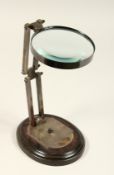 A LARGE MAGNIFYING GLASS on a stand