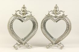 A PAIR OF HEART SHAPED LANTERNS.