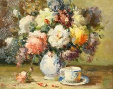 20th Century, a still life painting of flowers and a teacup, oil on panel, indistinctly signed, 8