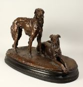 Giacomo Merculiano (1859-1935) Italian, a bronze group of Borzoi dogs, one recumbent the other
