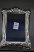 An Art Nouveau silver photograph frame.