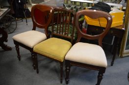 A pair of Victorian mahogany dining chairs and another chair.
