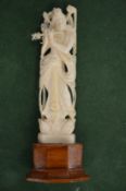 An eastern carved ivory deity.