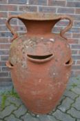 A large terracotta twin handled urn, 3ft high.