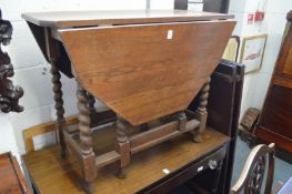An oak drop leaf table.