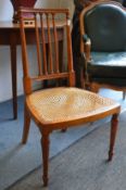 A satinwood occasional chair.