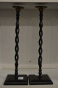 A pair of open barley twist candlesticks.