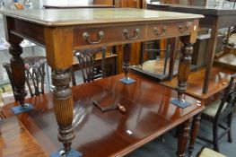 A Victorian mahogany two drawer library table with inset leather top.