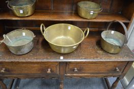 Three brass preserve pans.