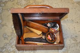 A shoe shine box and contents.