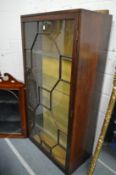 A mahogany display cabinet.
