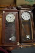 Two modern drop dial wall clocks.