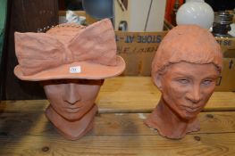 Two terracotta busts.