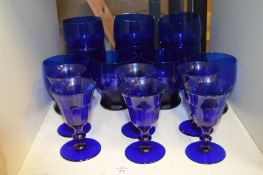 Blue glass drinking glasses and goblets.