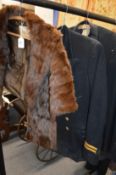 A fur cape, a Naval jacket and a dress suit.