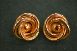 A pair of Lisa Jones swirl earrings.
