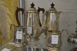 A silver four-piece coffee service.