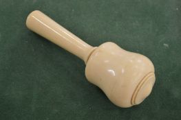An ivory mallet.