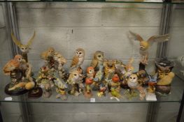 A large collection of bird ornaments.
