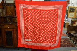 A Yves St Laurent silk scarf.