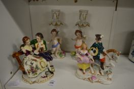 Decorative porcelain figure groups and candlesticks.