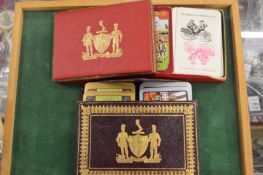 Two boxed sets of playing cards.