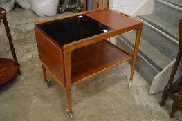 A Swedish teak two tier drop flap tea trolley.