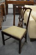 A mahogany dining chair.
