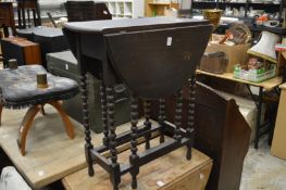 A small oak drop leaf table.