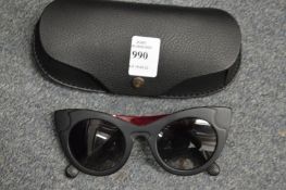 A pair of Carrera sunglasses, cased.