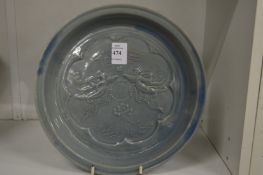 A Chinese circular moulded dish.