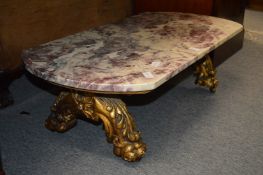 A marble top coffee table with giltwood base.