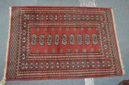 A small Bokhara rug.