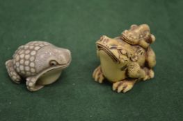 Two frog netsukes.