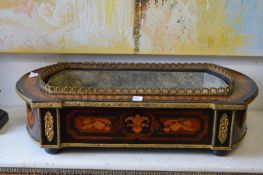 A 19th century French ebonised and marquetry jardiniere with ormolu mounts.