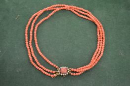A coral and pearl necklace.