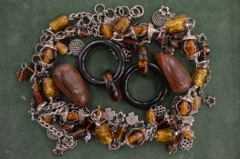 A good Monies silver and amber necklace with horn earrings, complete with bag.
