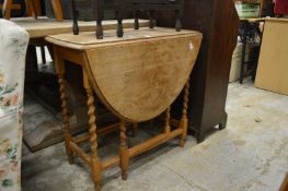 An oak drop leaf table.